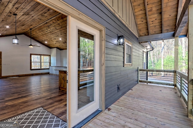 wooden deck featuring ceiling fan