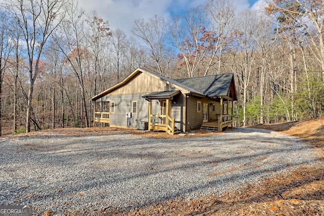 view of side of home featuring central AC