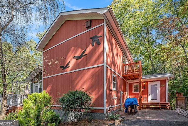 view of property exterior with a balcony