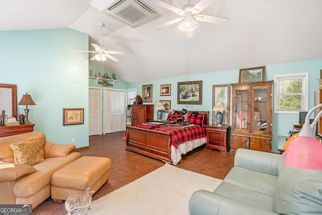 bedroom with dark hardwood / wood-style floors, ceiling fan, and vaulted ceiling