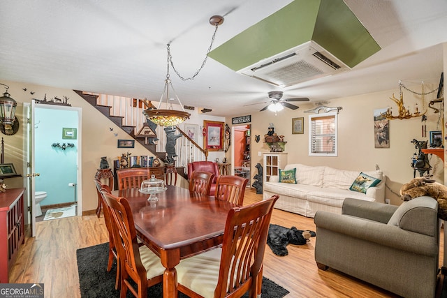 dining room with light hardwood / wood-style floors and ceiling fan