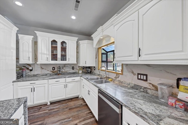 kitchen featuring white cabinetry, stainless steel dishwasher, sink, and dark hardwood / wood-style flooring