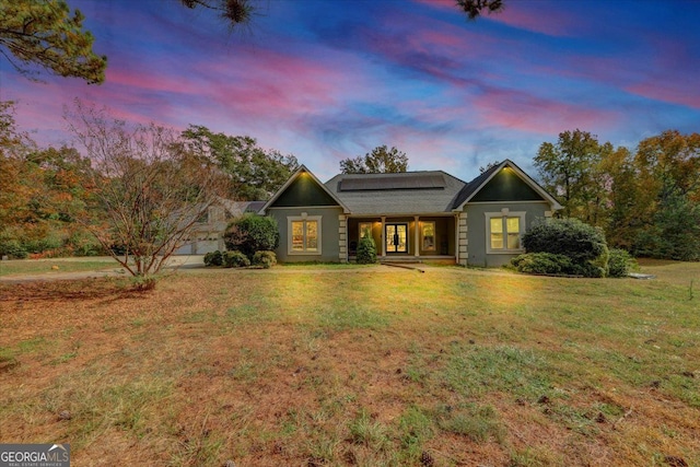 view of front of property with a yard