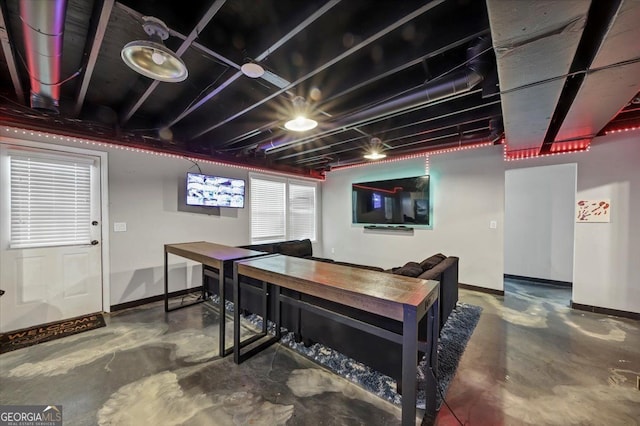 game room with concrete flooring