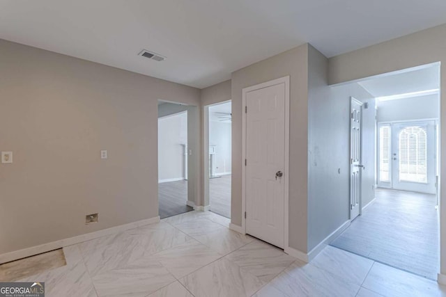 hallway with light hardwood / wood-style flooring