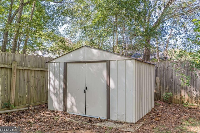 1983 Smithfield Ave, Ellenwood, GA 30294 - view of shed featuring a fenced backyard
