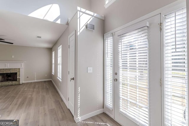 foyer entrance featuring ceiling fan and light hardwood / wood-style floors