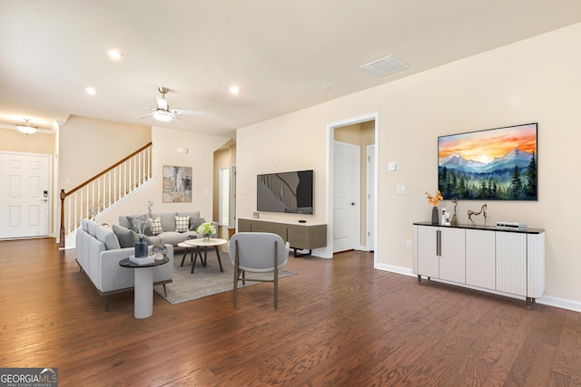 living room with dark hardwood / wood-style floors and ceiling fan