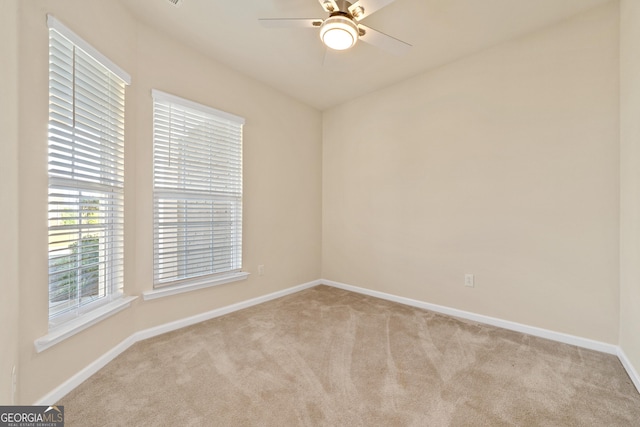 carpeted empty room with ceiling fan