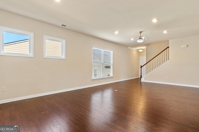 unfurnished room featuring ceiling fan and dark hardwood / wood-style floors