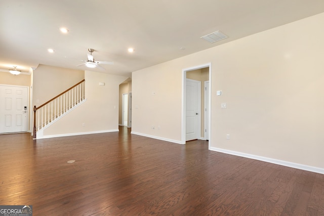 interior space with ceiling fan and dark wood-type flooring