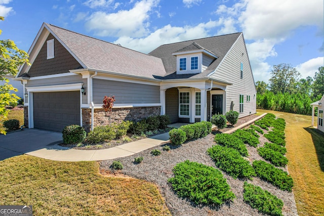 view of front facade featuring a garage and a front yard