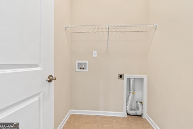 washroom with hookup for a washing machine, light tile patterned floors, and hookup for an electric dryer