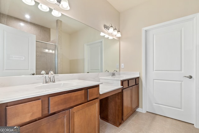 bathroom featuring tile patterned flooring, vanity, and a shower with door