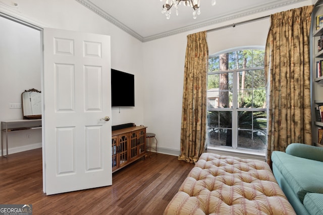 interior space with crown molding, dark hardwood / wood-style floors, and a chandelier