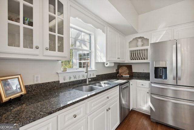 kitchen featuring white cabinetry, appliances with stainless steel finishes, sink, and dark wood-type flooring