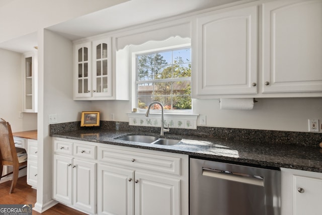 kitchen featuring dishwasher, white cabinets, and sink