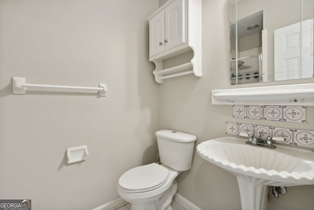 bathroom with toilet and sink