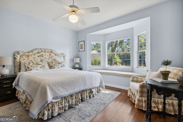 bedroom featuring ceiling fan and dark hardwood / wood-style flooring