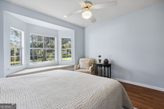 bedroom with hardwood / wood-style floors and ceiling fan