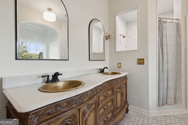 bathroom with vanity and curtained shower