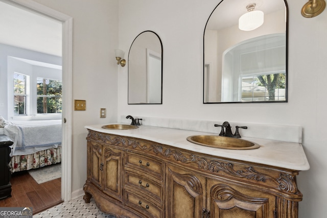 bathroom with vanity and hardwood / wood-style floors