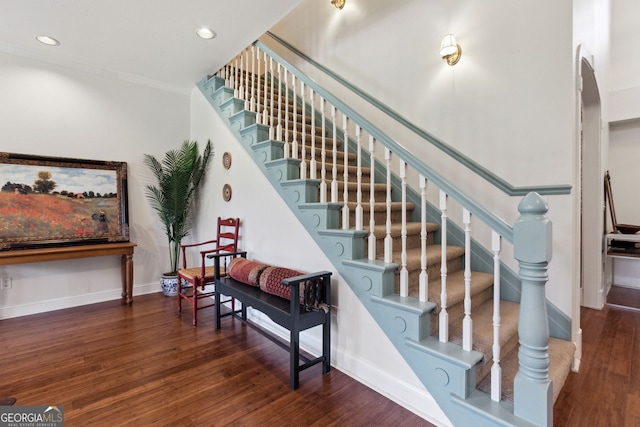 staircase featuring wood-type flooring