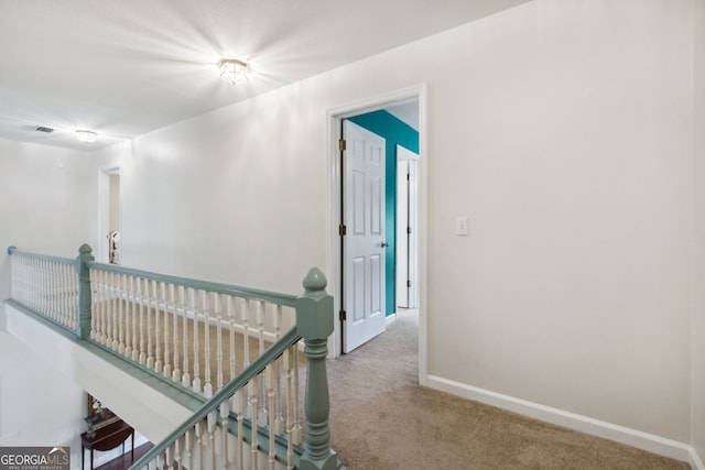 corridor featuring carpet flooring