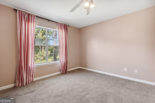 carpeted empty room with ceiling fan