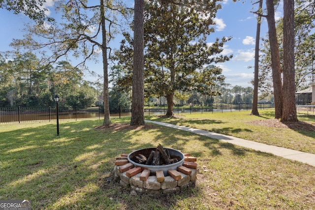 view of yard with an outdoor fire pit