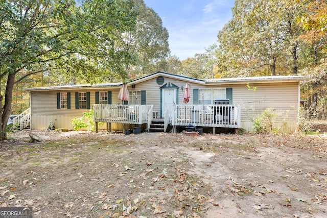 view of front of property with a deck