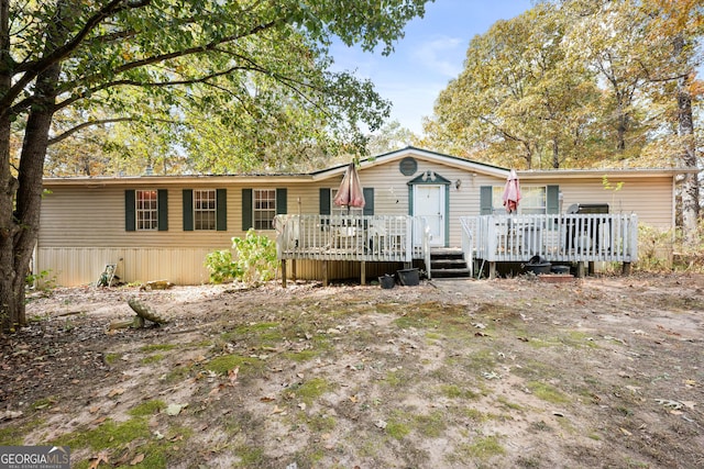 view of front facade featuring a wooden deck