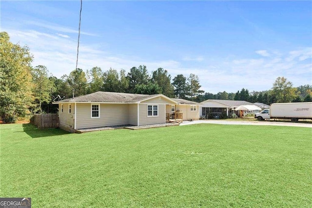 ranch-style home with a front yard