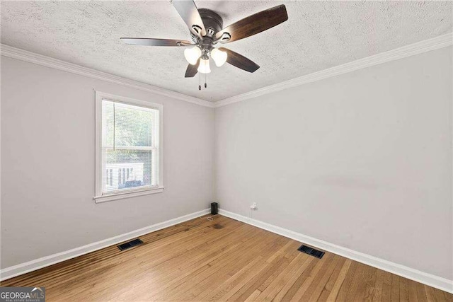 unfurnished room with hardwood / wood-style flooring, ceiling fan, and a textured ceiling