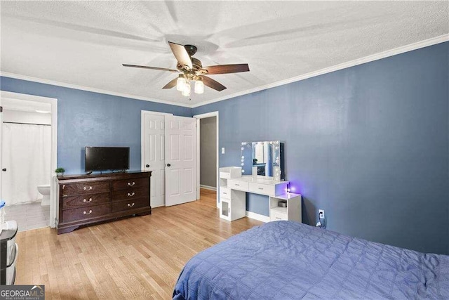 bedroom featuring ensuite bathroom, crown molding, ceiling fan, and light hardwood / wood-style floors