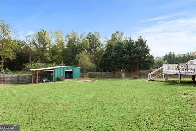 view of yard featuring a wooden deck