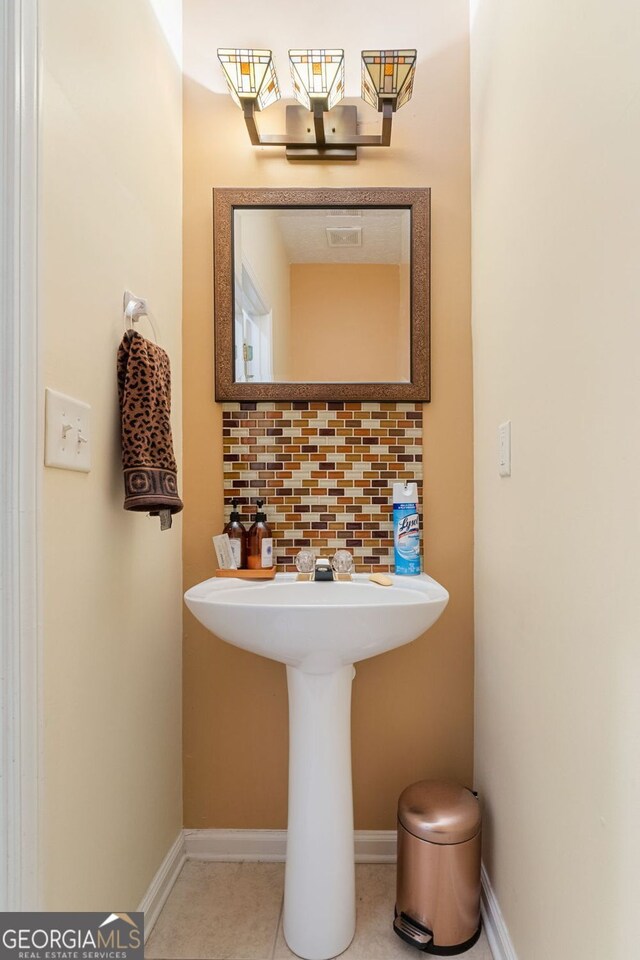 bathroom with tasteful backsplash