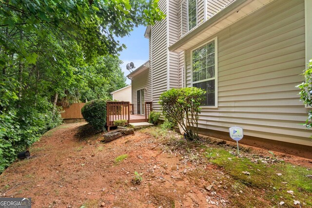 view of yard with a wooden deck