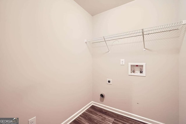 washroom with hookup for a washing machine, dark hardwood / wood-style flooring, and hookup for an electric dryer