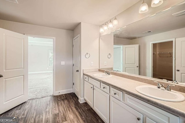 bathroom featuring vanity and hardwood / wood-style floors