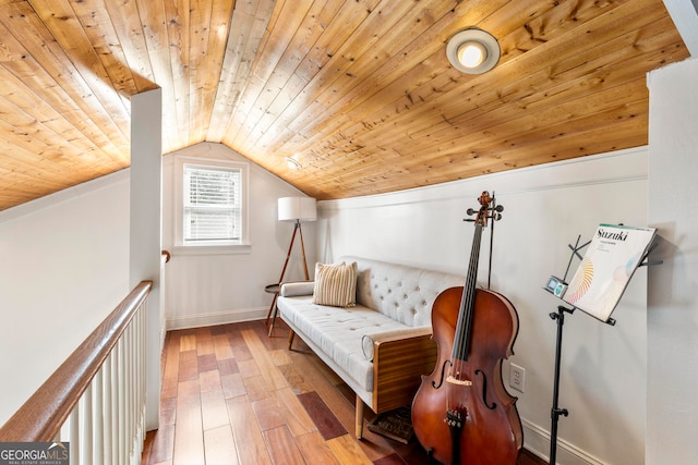 sitting room with lofted ceiling, wood ceiling, and light wood-type flooring