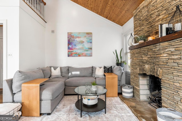 living room featuring high vaulted ceiling, a stone fireplace, and wooden ceiling