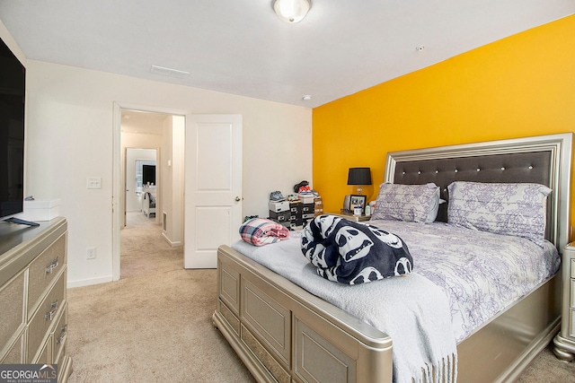 bedroom featuring light colored carpet