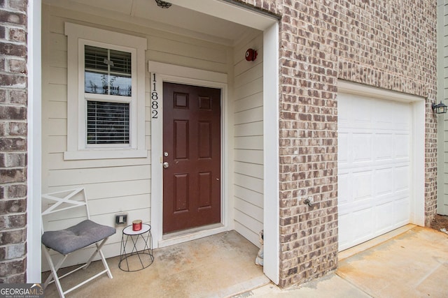 property entrance with a garage