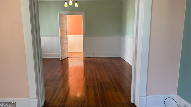 hallway with dark hardwood / wood-style floors