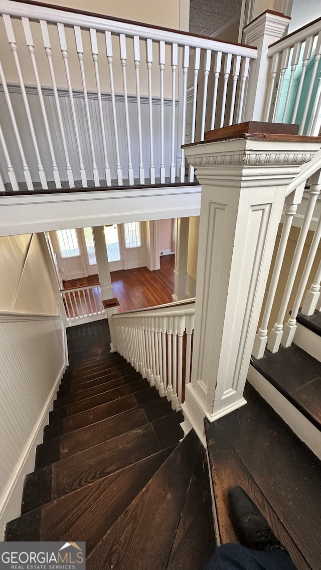 staircase featuring hardwood / wood-style flooring