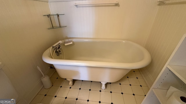 bathroom featuring tile patterned floors and a bathing tub