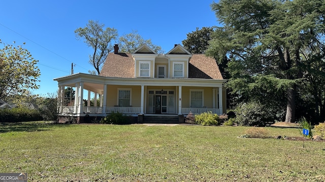 view of front of property with a porch and a front lawn