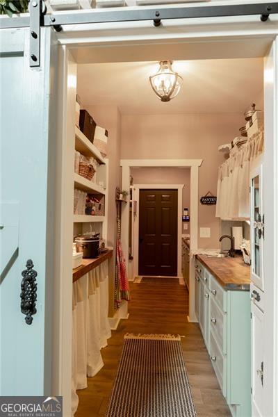 mudroom with dark hardwood / wood-style floors