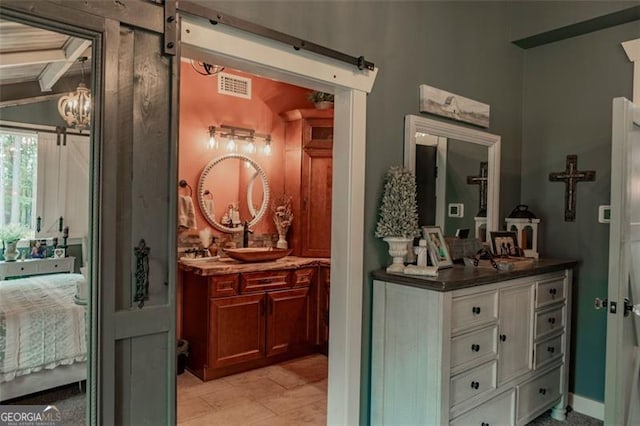 bathroom featuring vanity and beam ceiling